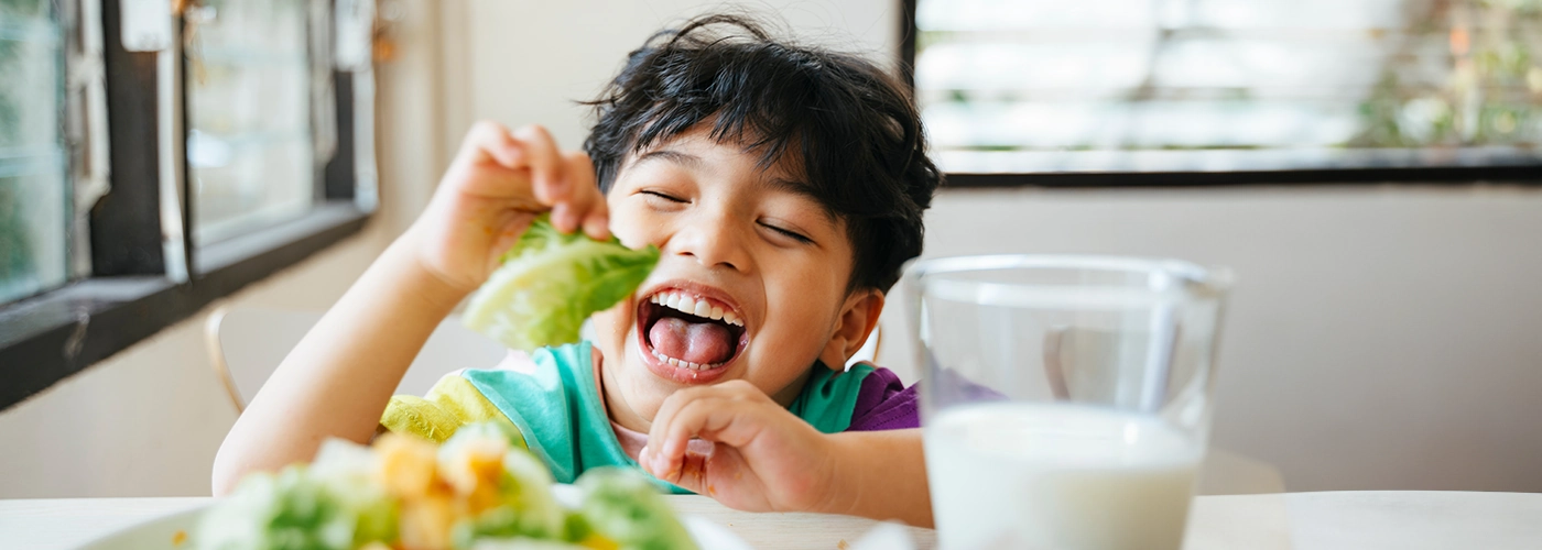 happy child enjoying a meal