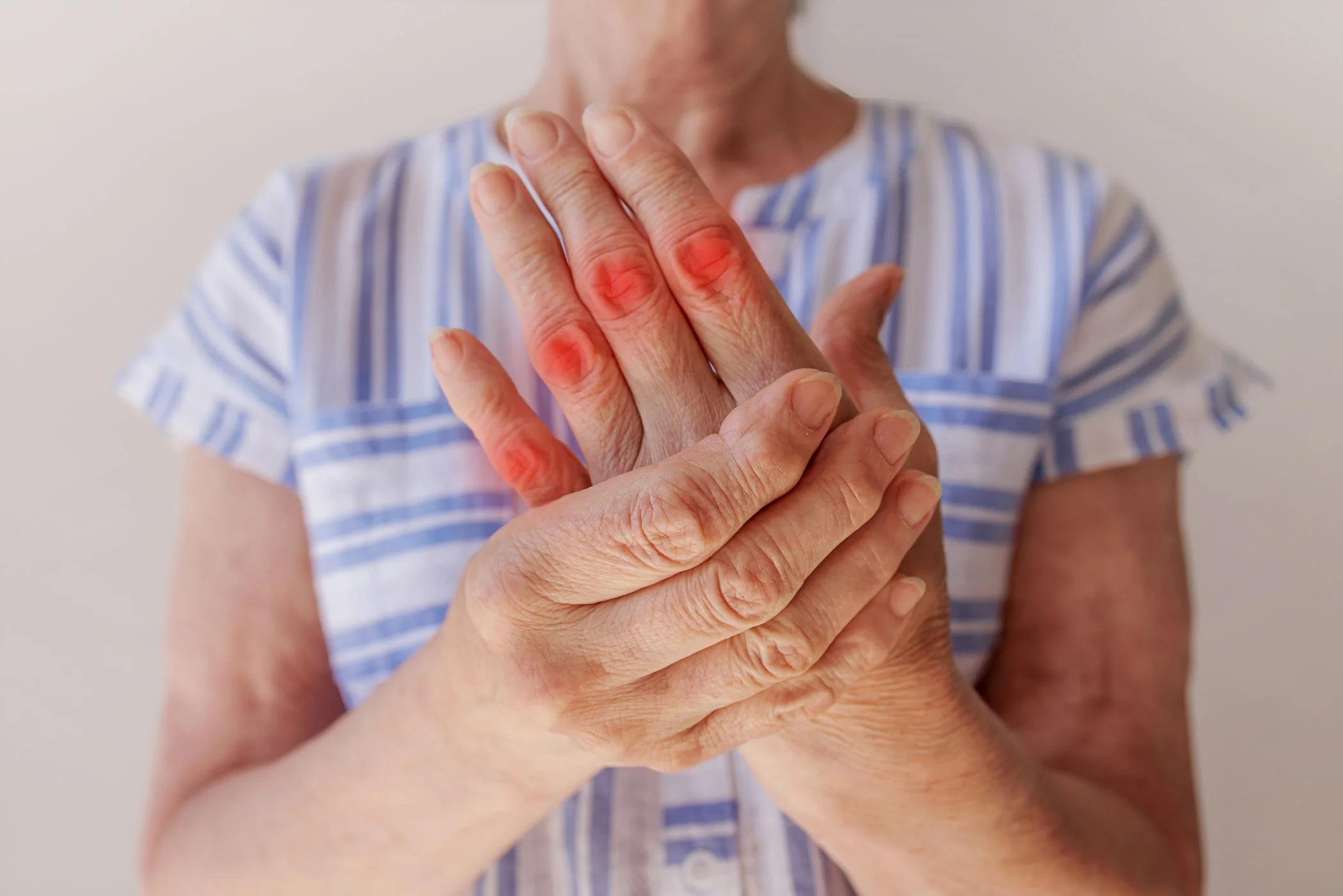 elderly-woman-suffering-from-pain-her-hand-rubs-her-wrist-closeup